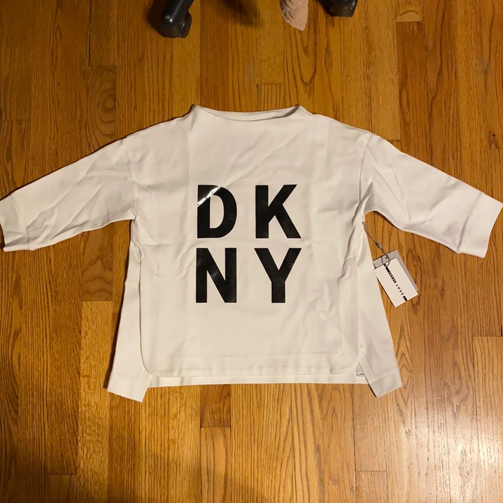 White athletic DKNY sweater.